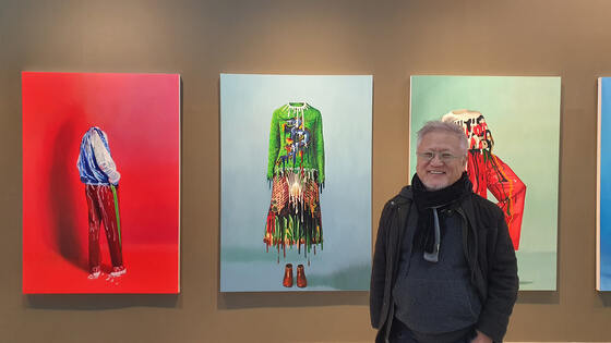 Ahn Chang Hong stands in front of his artworks from ″Ghost Fashion″, Savina Museum of Contemporary Art.
